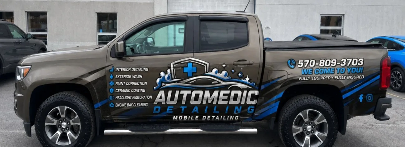 Photo mockup of a truck with a detailing business wrap design